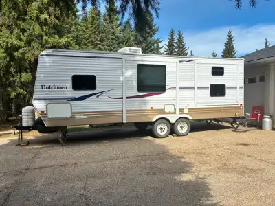 26’ Dutchmen Holiday Trailer 2 slides large fridge New Awning