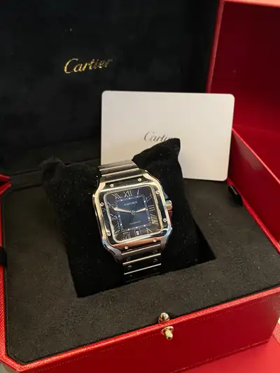 100% authentic and original Cartier Santos large with blue dial Comes with box, card , leather brace...