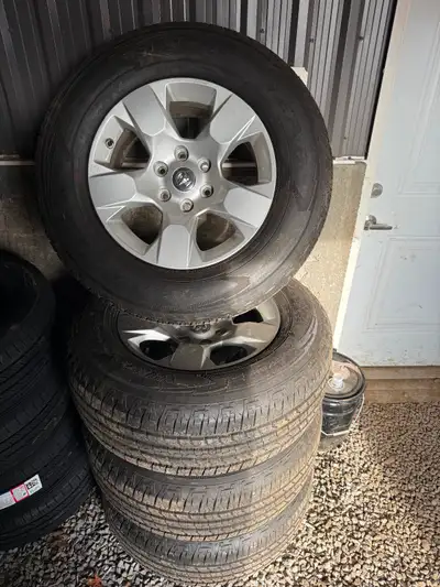 Set of brand new Ram rims and tires (take offs) Mud & Snow 275/65R18