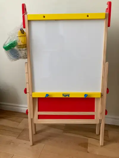 Double-sided easel with Blackboard and features a magnetic Whiteboard for attaching magnetic letters...