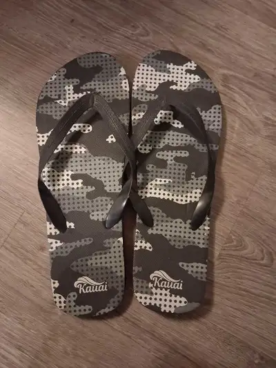 Step into summer with these Kauai flip flops, featuring a stylish camo design and comfortable fit, p...