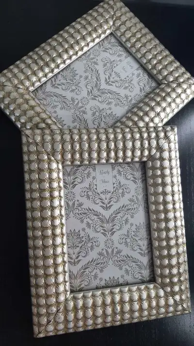 Add a touch of elegance to your cherished memories with these stylish silver picture frames, perfect...