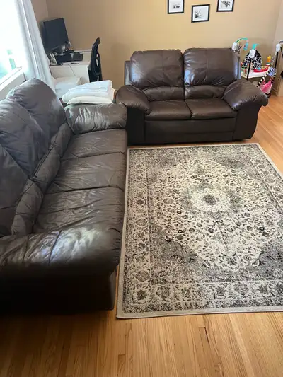 Brown leather couch set in good condition. Three seater and love-seat. Smoke free, pet free home. Me...