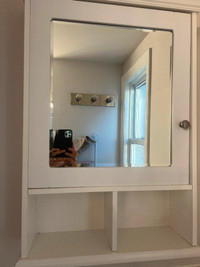 Medicine cabinet with mirror.