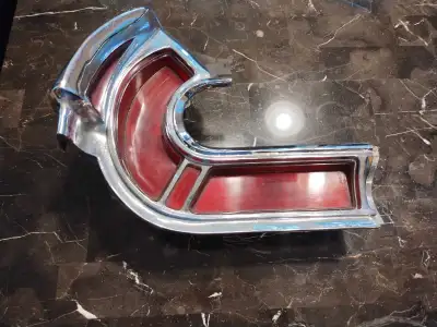 1962 Bonneville taillight housing and lenses. No cracks in bezel or lenses. Lenses worth the price a...