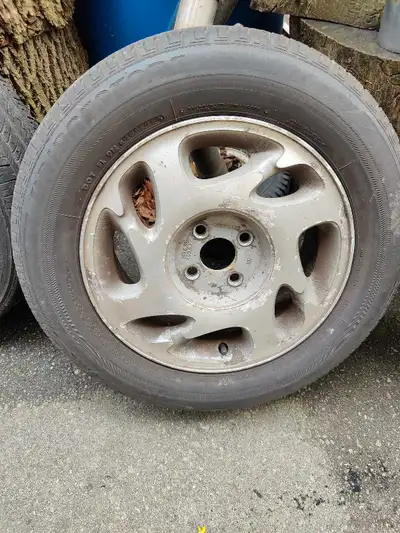 Rims and tires on aluminum rims 4 bolts 195/65/15 $175 call or text 905-467-0746