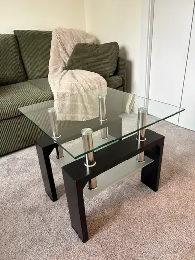 Nice industrial looking table with 2 surfaces for putting things on. The legs & bottom glass are in...