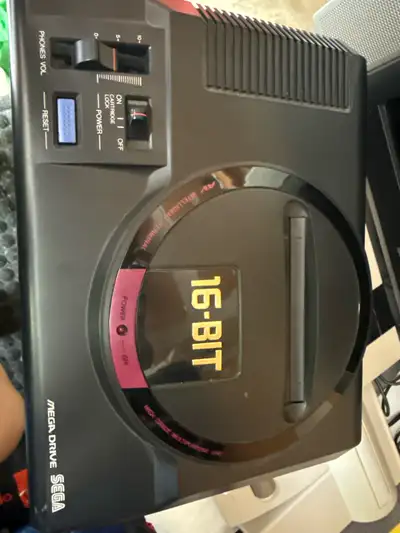 Relive the glory days of 16-bit gaming with this Sega Mega Drive (model HAA-2510)! This console, whi...