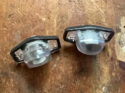Set of license plate lights which I bought for a 2007 or 2008 Honda Fit. Compatible with Honda Fit O...