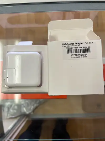 This is a used Apple 30W USB-C Power Adapter, perfect for quickly and efficiently charging your MacB...