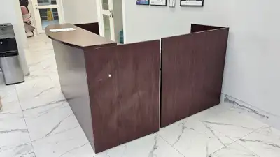 Spacious, modern brown desk in fair to good condition. It features multiple, deep drawers for storag...