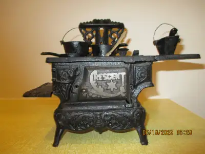 Miniature cast iron stove, vintage., View more