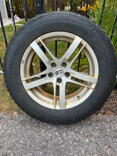 Winter rims 5 bolt 114.3mm with Uniroyal tiger paw snow tires in good condition.