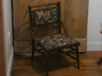 Low seat hand carved antique tapestry chair