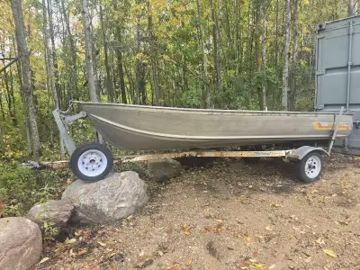 14 ft fishing boat. Comes with trailer at a 9.8 hp motor works good Has a holding tank for fish that...