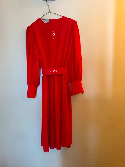 Beautiful red chiffon dress. This is a vintage dress that was never worn. It is a size 5. Asking $25...