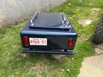 Extremely light Alluminum trailer for behind a Touring motorcycle or Trike. Like new and ready to go...