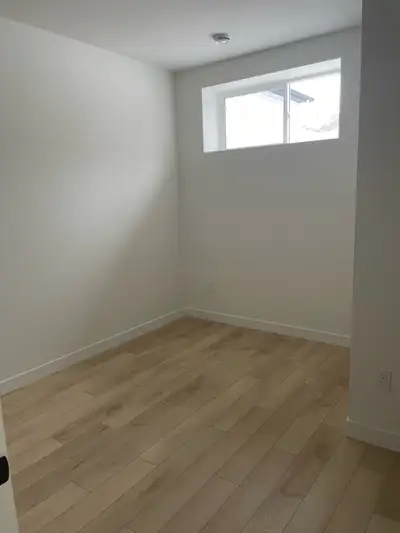 Spacious private room available in a lower level suite in a new building. The unit features a shared...
