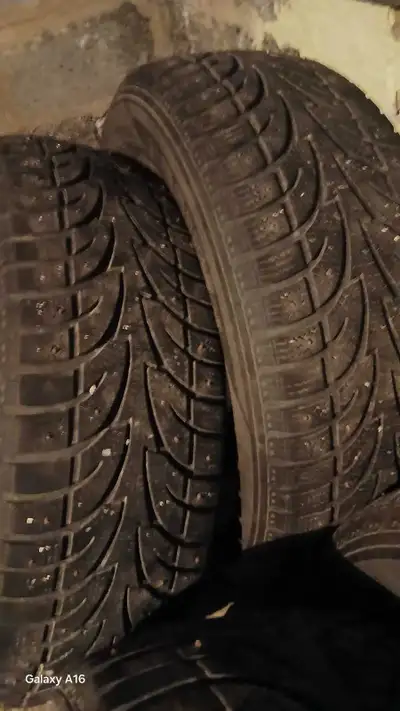 I'm selling a set of four studded winter tires, perfect for providing extra grip and safety on icy r...