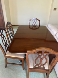 Dining table +1 leaf, 4 chairs, curio and buffet