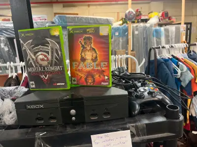 Xbox original two controllers and two games , View more