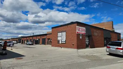 Industrial building with multiple small-bay units available for lease. Garage door, man-door and fro...