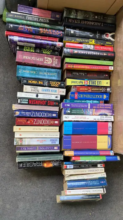 Two boxes of books, over 50 novels and assorted cook books, not ever gonna read them and now just ta...