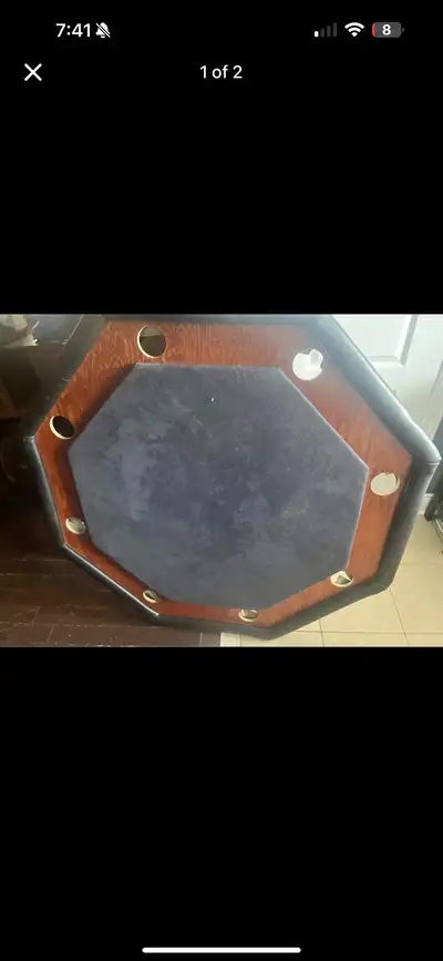 Elevate your game nights with this octagon-shaped poker table, perfect for Texas Hold'em or any card...