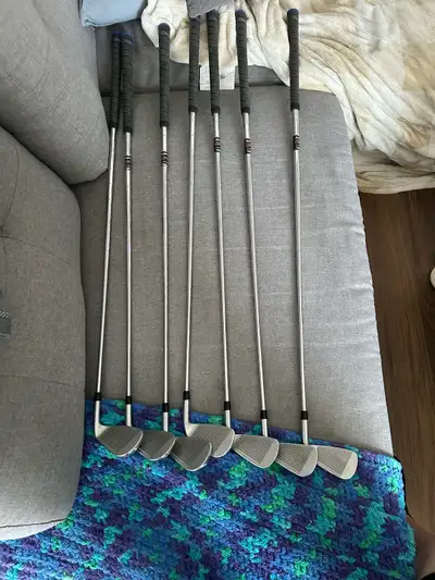Left Handed Stiff PXG 0211 Dualcor irons with true temper elevate 95 gram shafts and Winn Dritac gri...