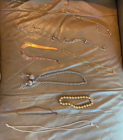 Selling the entire lot for $40 on the advice of a jeweller. Everything is plate with the dolphins wh...