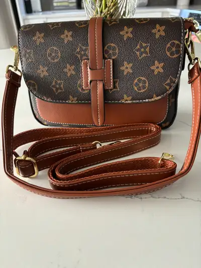 Cute purse never used comes with short and long strap, View more
