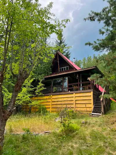 A-frame Cedar Cabin lake view cabin and double car garage with mother inlaw suite above.
