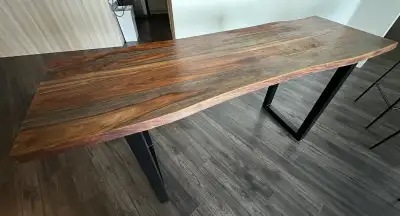 Selling a large solid wood dining table with 5 matching chairs. Originally purchased for $1500 (incl...
