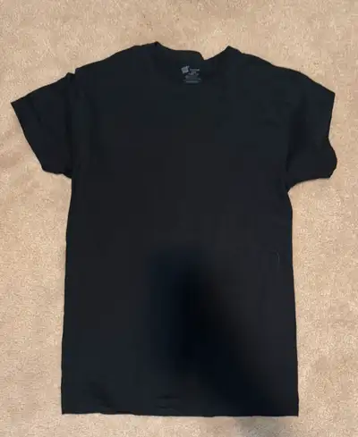 Simple and versatile black t-shirt in size Medium. Soft cotton material, great for casual wear or la...
