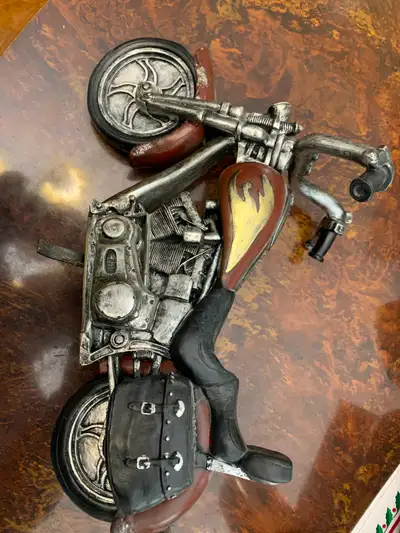This motorcycle shows wonderful detailing and color, no damage at all