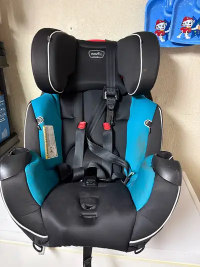 This is an Evenflo car. As you can see from the photos, it's in used condition, showing some wear, b...