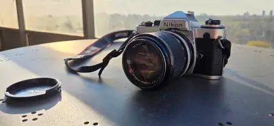 Vintage 1980s NIKON FE + 43-86mm f3.5 lens, View more