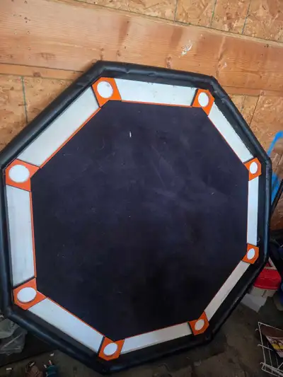 This octagonal poker table provides an excellent surface for your next home game and is being sold i...