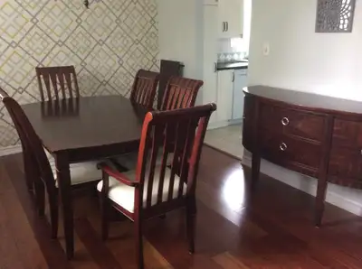Lightly used dining. 6 chairs (2 with arms). 66 inches length Comes with leaf extension increasing l...