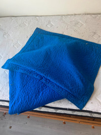 blue pillow duvet cover with matching blue bed blanket