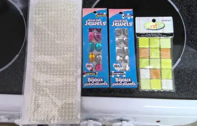 Stick on jewels and pearls, and 1 package small mosaic tiles. $1 each package or all $3. Pickup only...