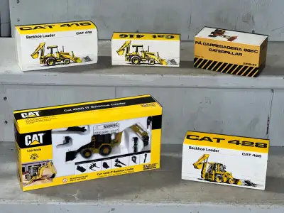 PARKER PICKERS - CAT 966C and CAT 428 are SOLD!!! The 3 on the top stair - 2 versions of the CAT 416...