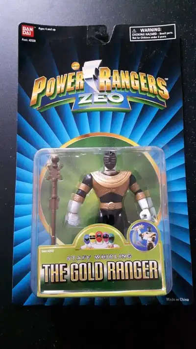 New in packaging, this is a vintage, unopened, Gold Ranger Action Figure from the Mighty Morphin Pow...
