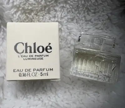 This is a Chloe L'eau Lumineuse Eau de Parfum miniature, containing 0.16 fl oz / 5ml of fragrance. A...