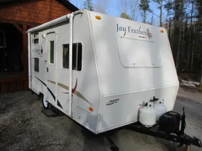 I've got a nice little 16' Jayco Featherlite Camper. It's got heat, AC, fridge, microwave, 4 burner...
