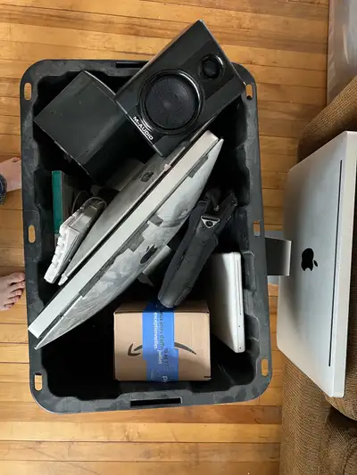 Selling a box of used Apple computer and accessories. The box includes 4 iMacs, MacBook, speakers, k...