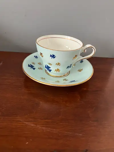 Vintage Aynsley Fine Bone China teacup and saucer set featuring a pale aqua glaze adorned with gold...
