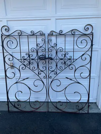 Hand forged beautiful wrought iron gates approximately 100 years old for garden or interior. They we...