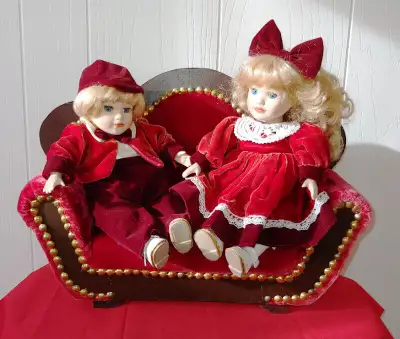 DOLL COUCH AND PORCELAIN DOLLS, View more