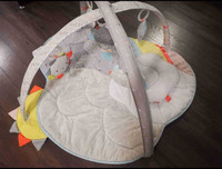 Baby play mat with hanging toys and pillow